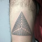 Triangle tattoo with a sacred geometry insdie