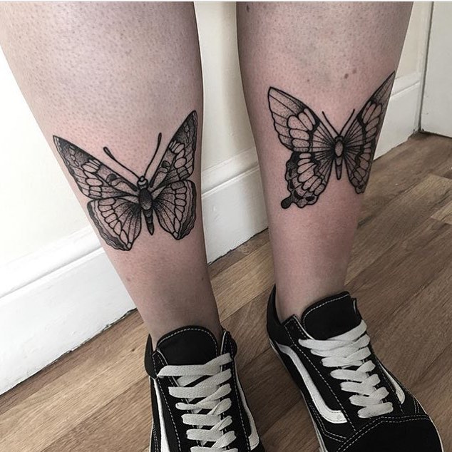 Two butterfly tattoos on the shins