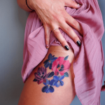 Watercolor blue and pink flower tattoo