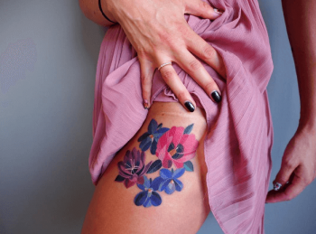 Watercolor blue and pink flower tattoo