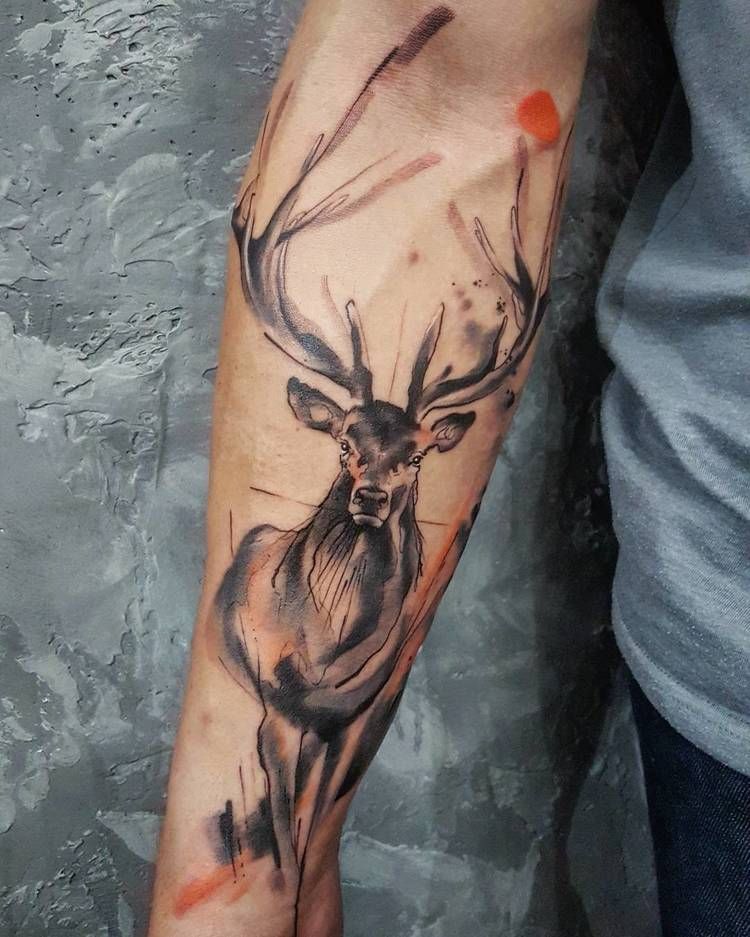 Watercolor deer tattoo on the arm
