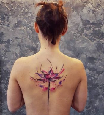 Watercolor flower tattoo on the back