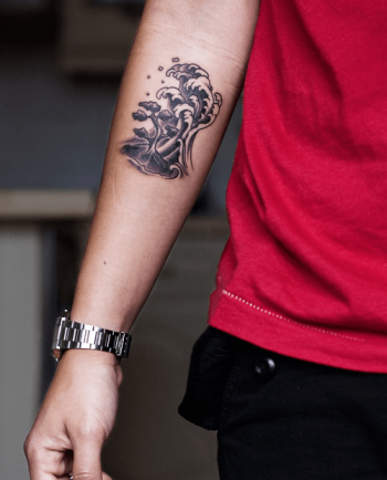 Wave and small island tattoo