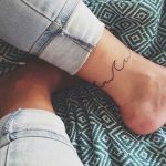 Wave tattoo on the ankle