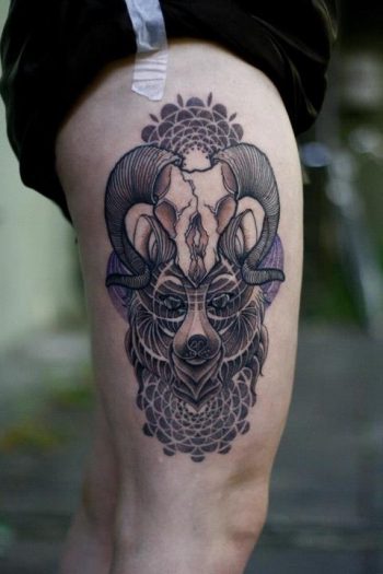 Wolf and antler tattoo on the thigh