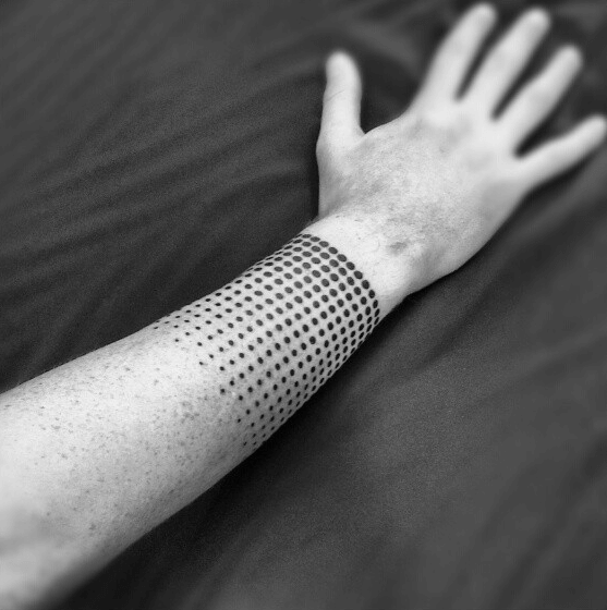 Disappearing dots armband tattoo