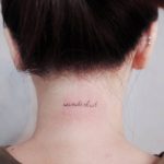 Wanderlust tattoo on the neck