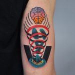 Abstract and colorful arm tattoo