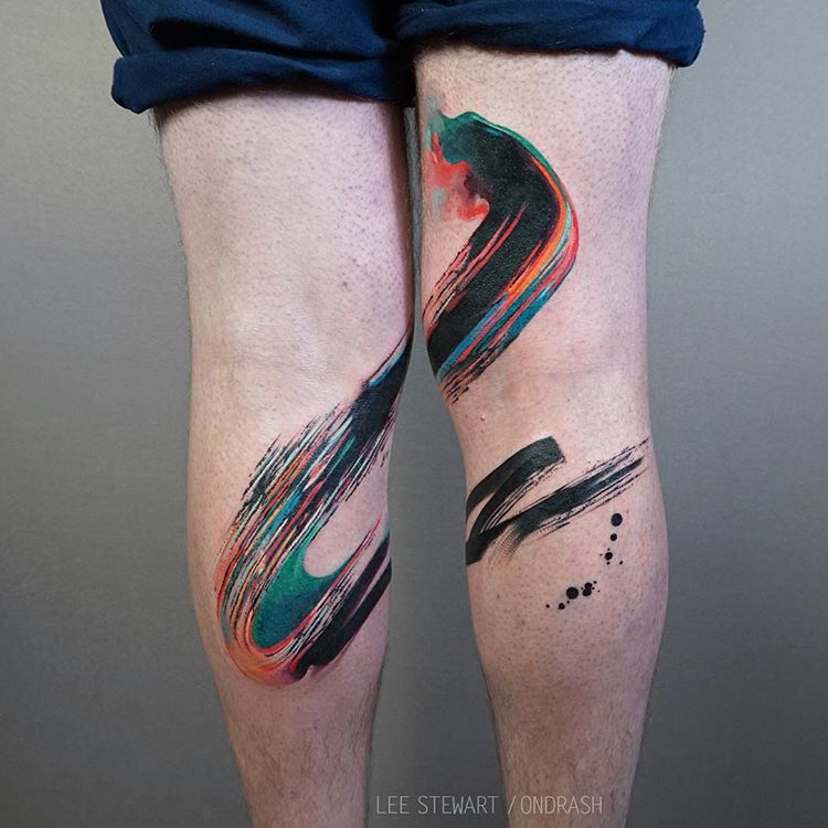 Abstract colorful paintbrush stroke tattoo on both legs
