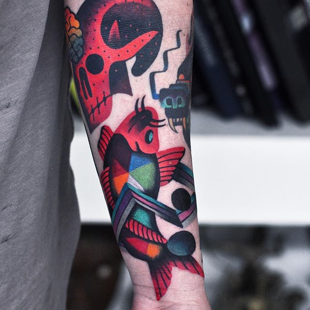 Abstract fish and skull tattoo