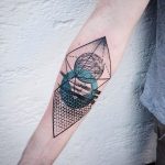 Abstract geometric tattoo on the forearm