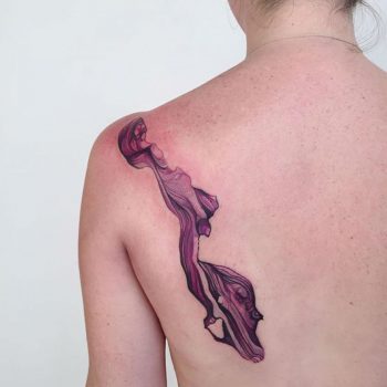 Abstract watercolor splash tattoo on the back