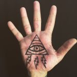 All seing eye tattoo on the palm