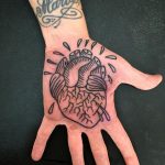 Anatomical heart tattoo on the palm