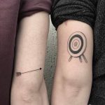 Arrow and target matching tattoos