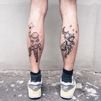 Astronaut and peter pan tattoos on the calves