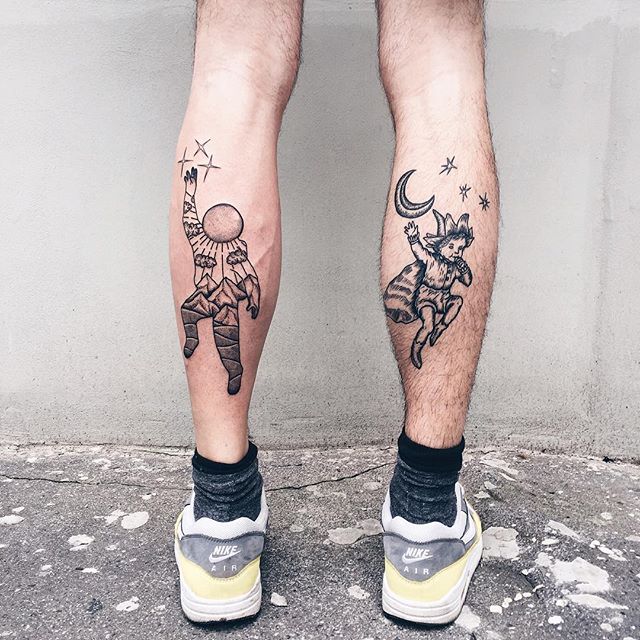 Astronaut and peter pan tattoos on the calves