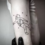 Astronaut tattoo on the arm
