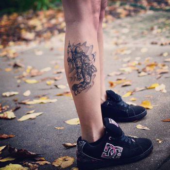 Astronaut tattoo on the right calf