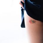 Beautiful flower tattoo on the leg