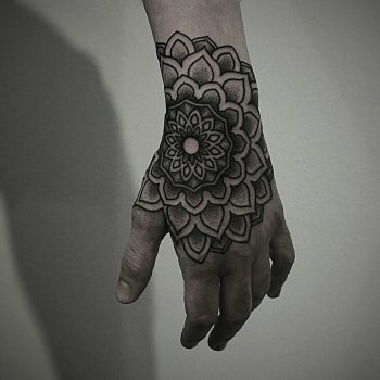 Beautiful mandala on the left hand