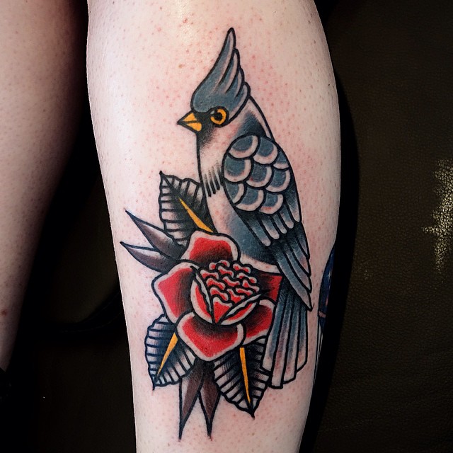 Bird on a rose tattoo