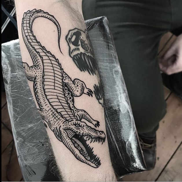 Black aligator tattoo