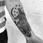 Black and grey anubis tattoo