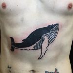 Black and linear whale tattoo