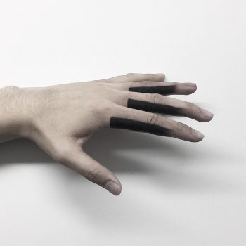 Black finger tattoos