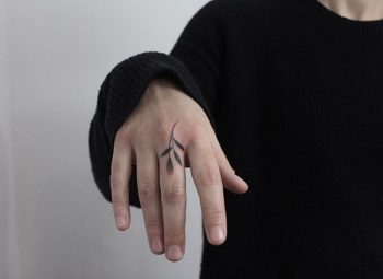 Black leaf tattoo