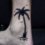 Black palm tree tattoo on the ankle