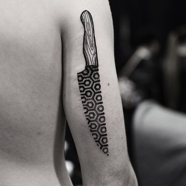 Black pattern knife tattoo