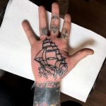 Black ship palm tattoo