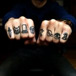 Black small finger tattoos