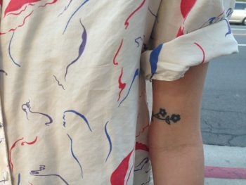 Black small rose on the upper arm