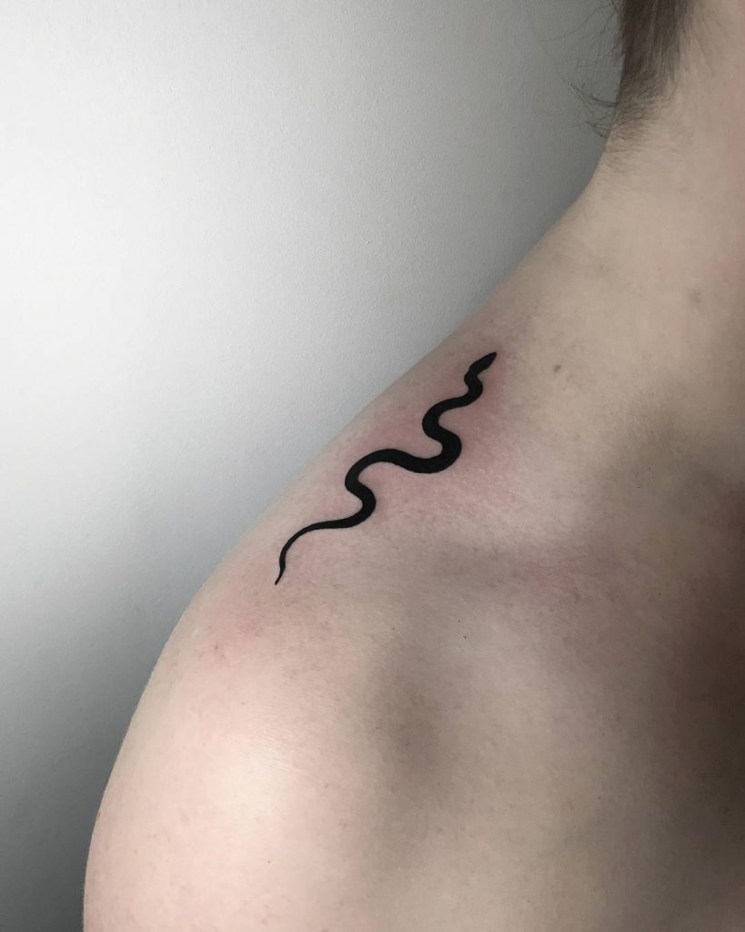 Black snake tattoo on the shoulder