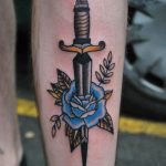 Blue rose and dagger tattoo