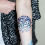 Circular blue floral pattern tattoo