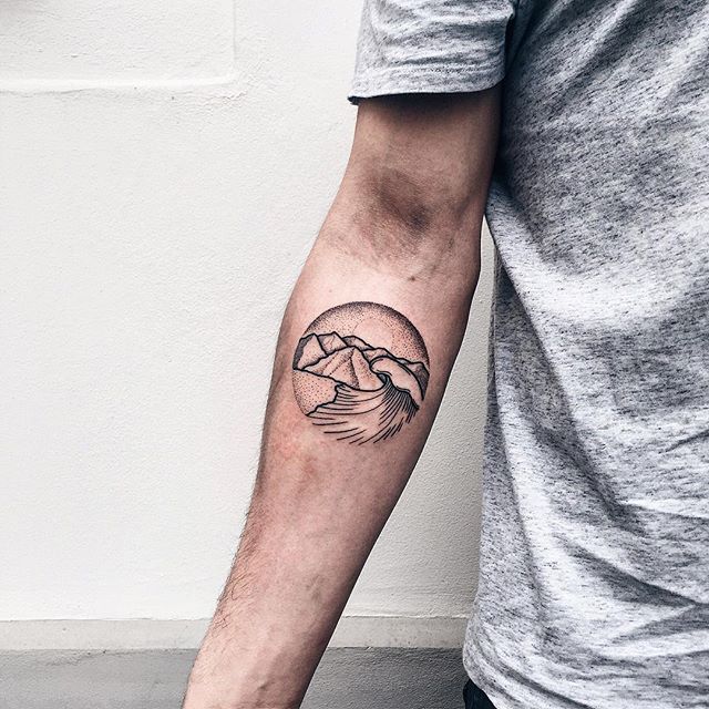 Circular wave and mountain tattoo 