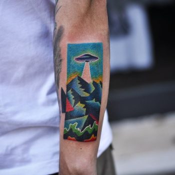 Colorful alien abduction tattoo