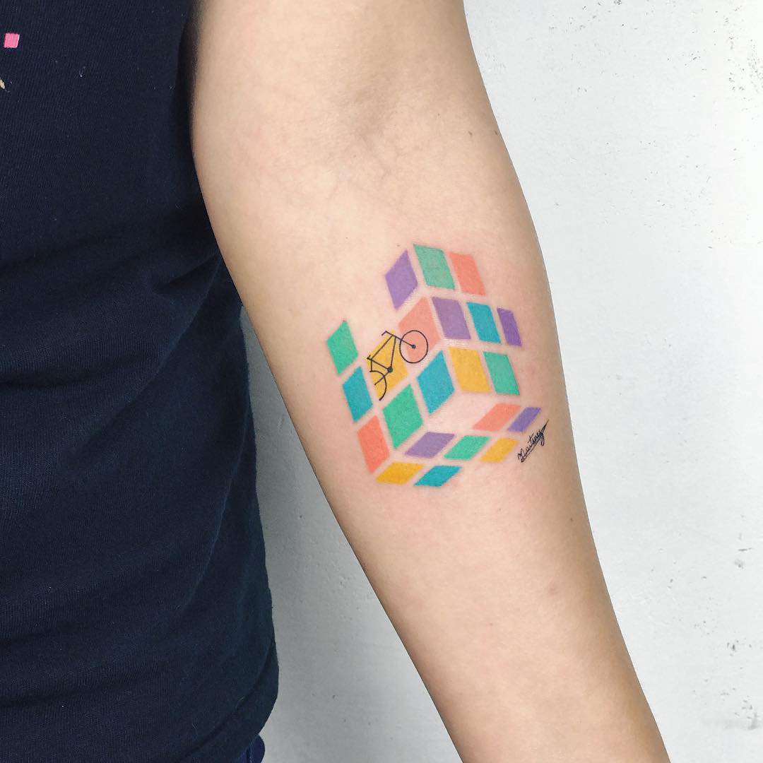 Colorful cube tattoo with a bicycle