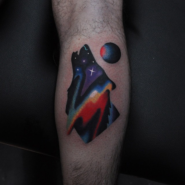 Colorful howling wolf tattoo