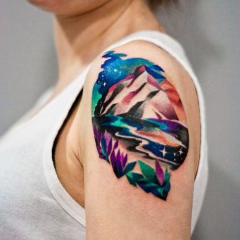 Colorful landscape arm tattoo