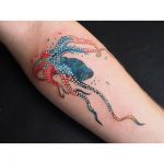 Colorful octopus tattoo on the forearm