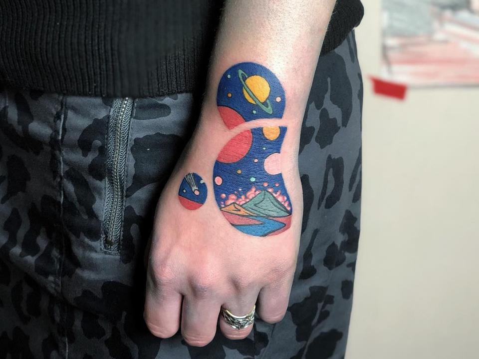 Cosmic landscape circles tattoo