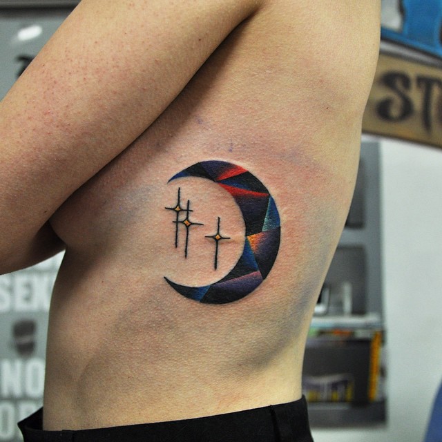 Crescent moon and three stars tattoo
