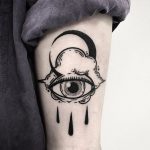Crying eye cloud and crescent moon tattoo