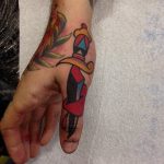 Dagger tattoo on the thumb