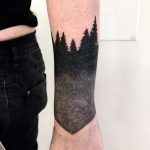 Dark forest wrist tattoo